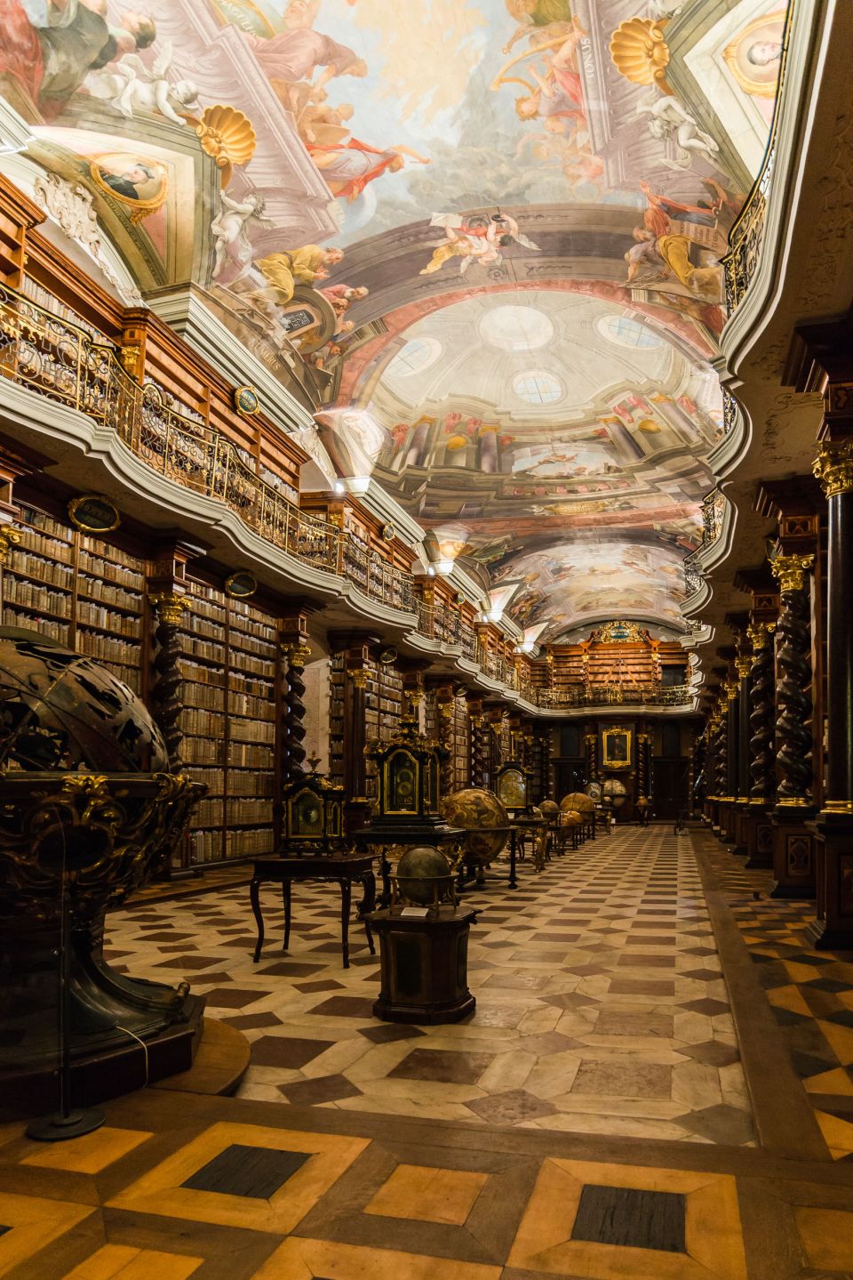 Inside of a library, with white columns and blue walls