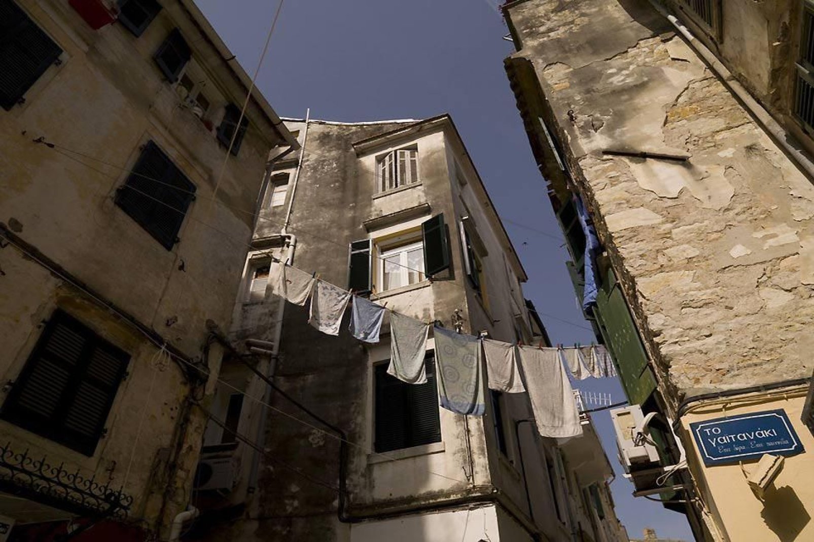 It is perfectly normal in Corfu to see washing hanging out to dry between two buildings.