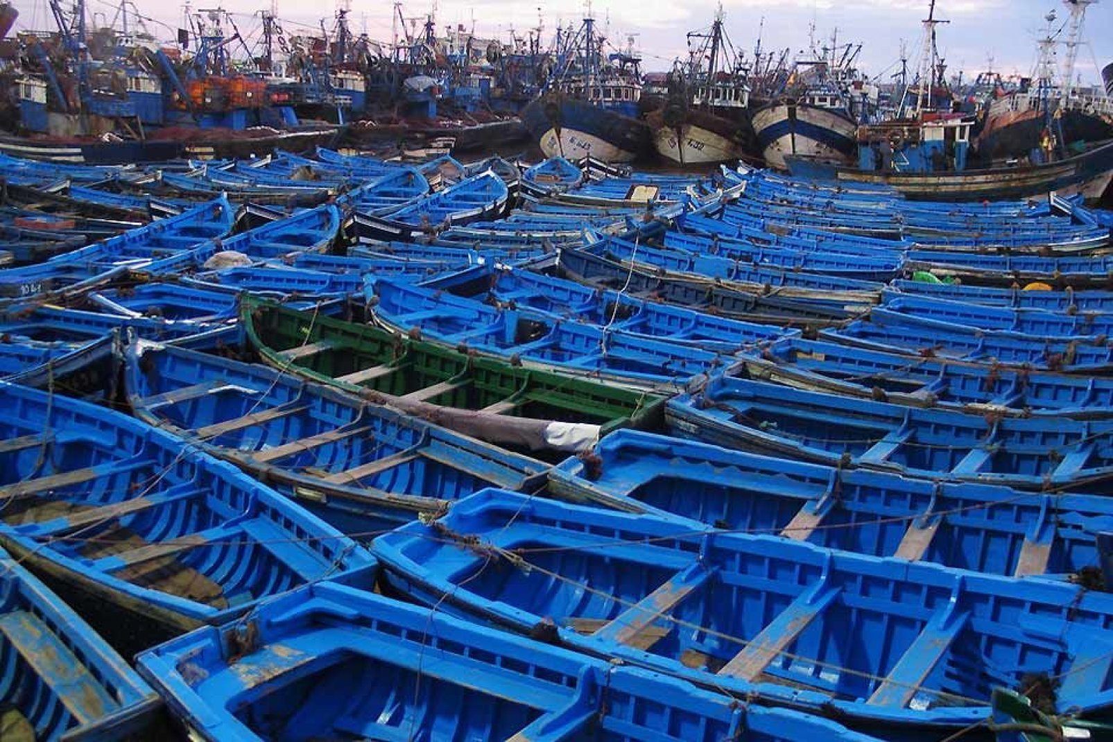 The boats in the traditional fishing port are blue to trick the sardines