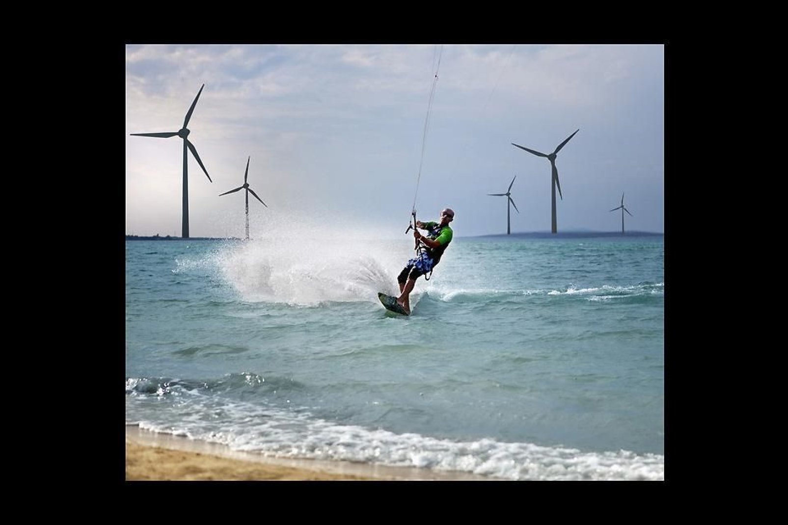 The Zadar coastline offers great watersports, here in front of some wind turbines